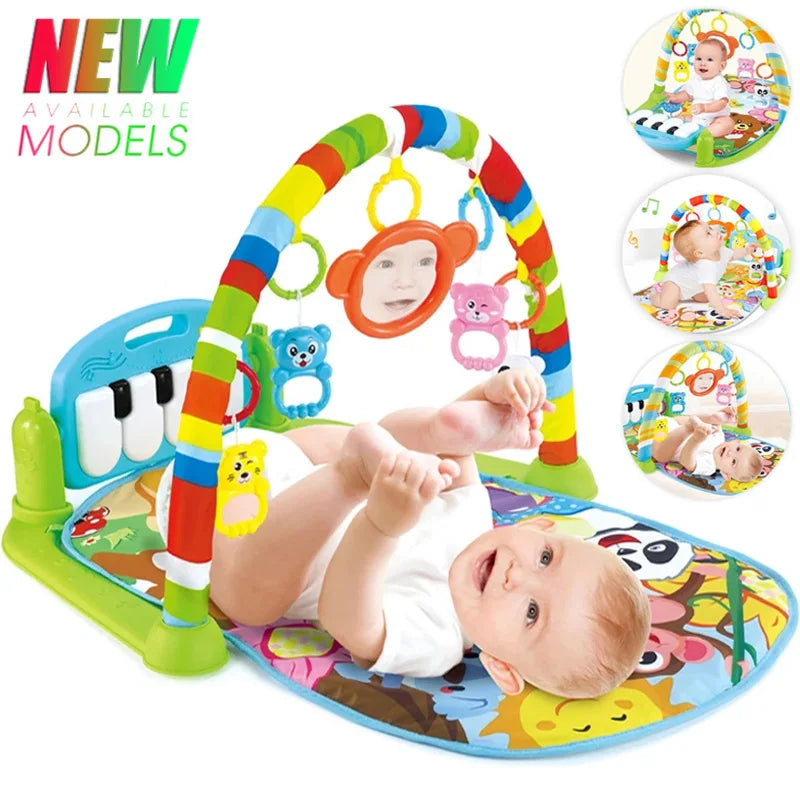 Baby lying on a play gym with kick piano and hanging toys
