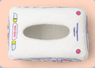 Tissue box toy opening for pulling scarves