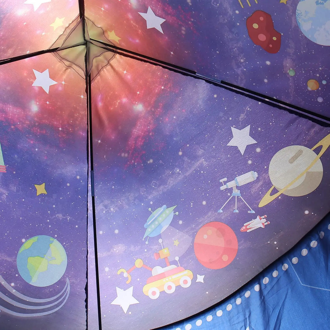 Inside the rocket play tent, space print roof