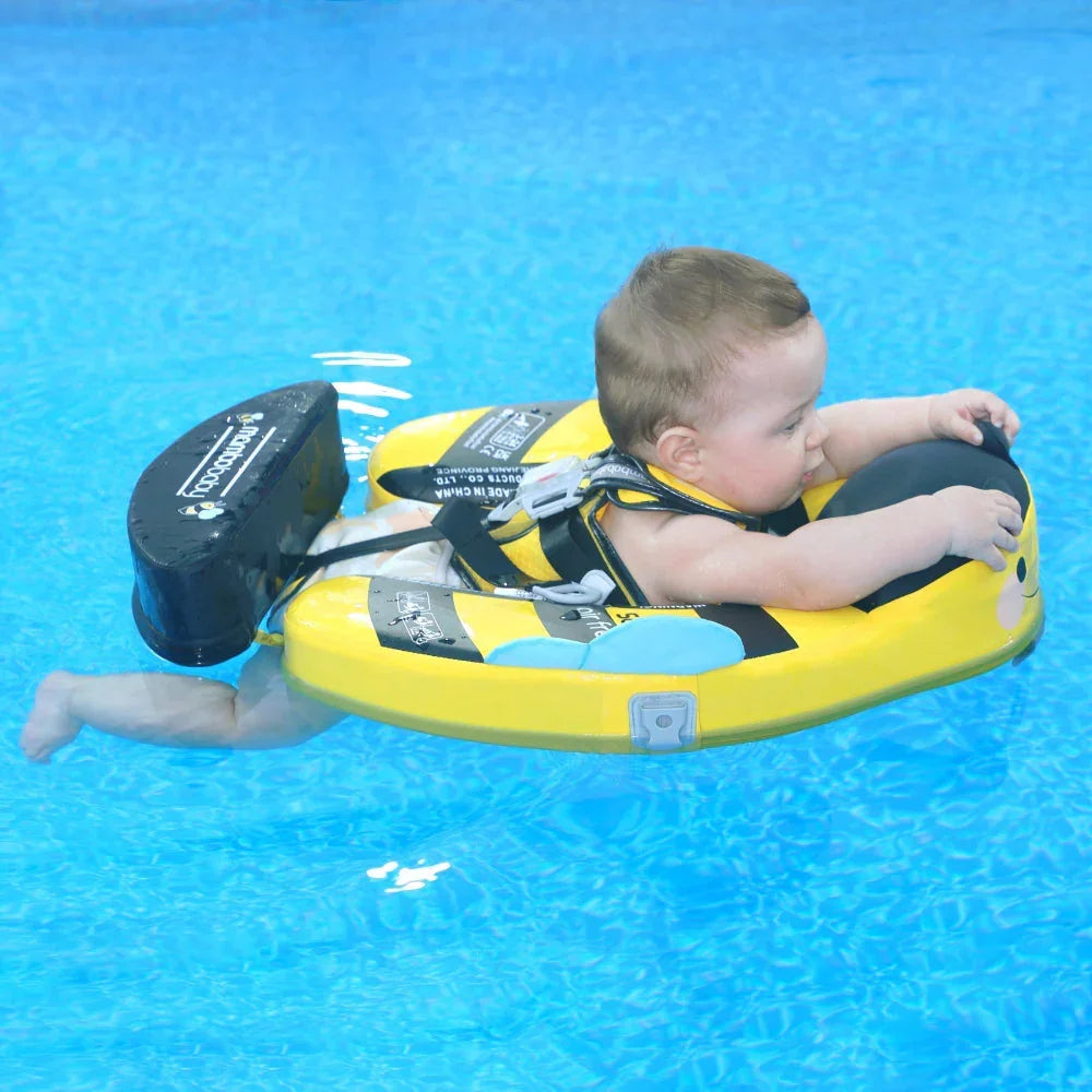 Baby resting on the chest pad of the Bee float, arms free to paddle