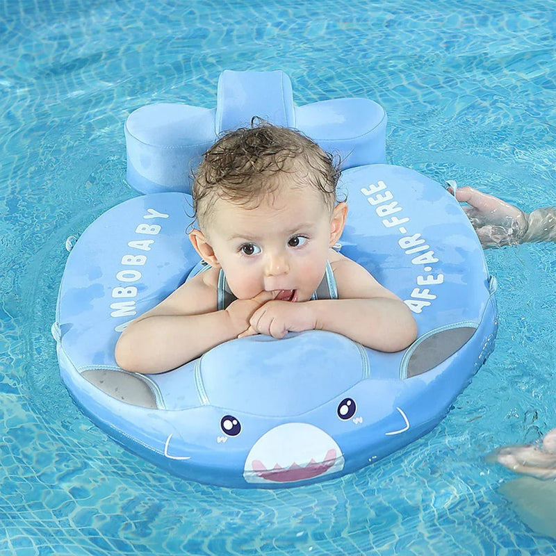 Baby resting on the chest pad of the Shark float, arms over the front