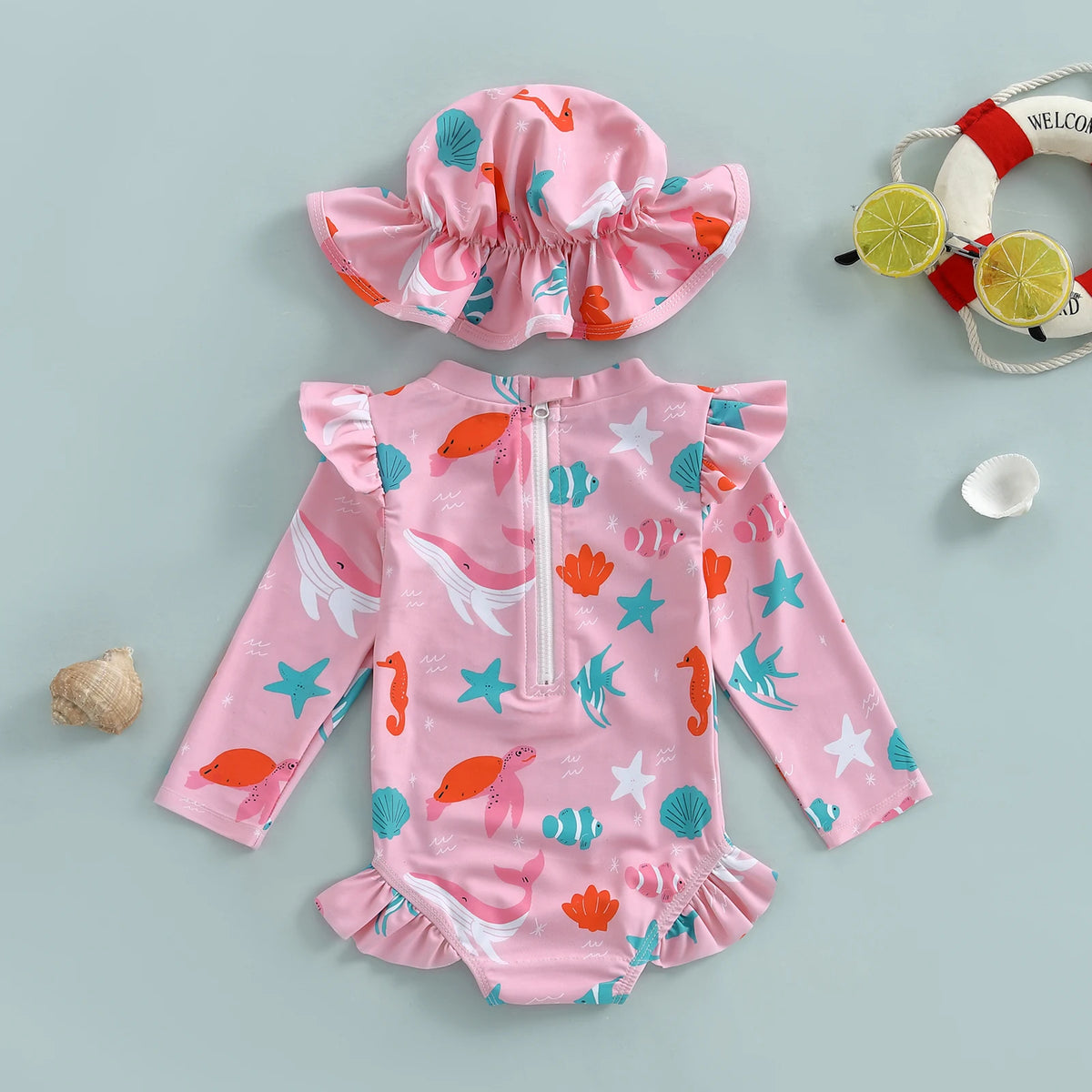 Pink baby swimsuit with ruffle and sun hat
