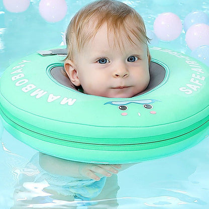Baby floating in a green Mambobaby neck float, chin and ears clear of the water
