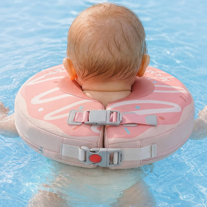 Baby resting on the water in a Mambobaby neck float, head supported and chin clear of the surface