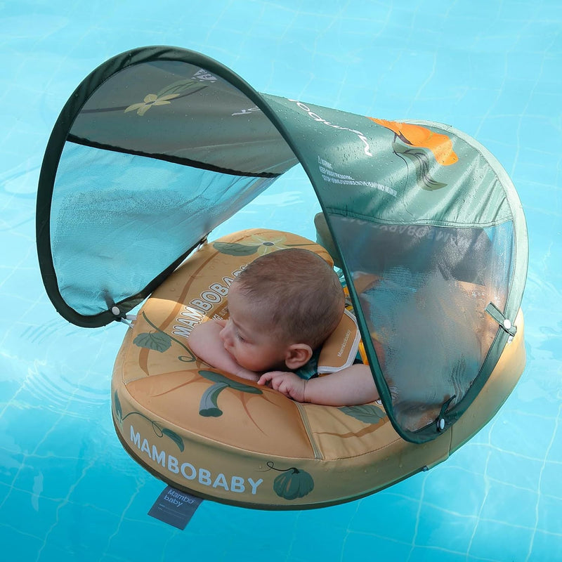 Baby lying on their front in the Mambobaby Pumpkin float with the canopy up