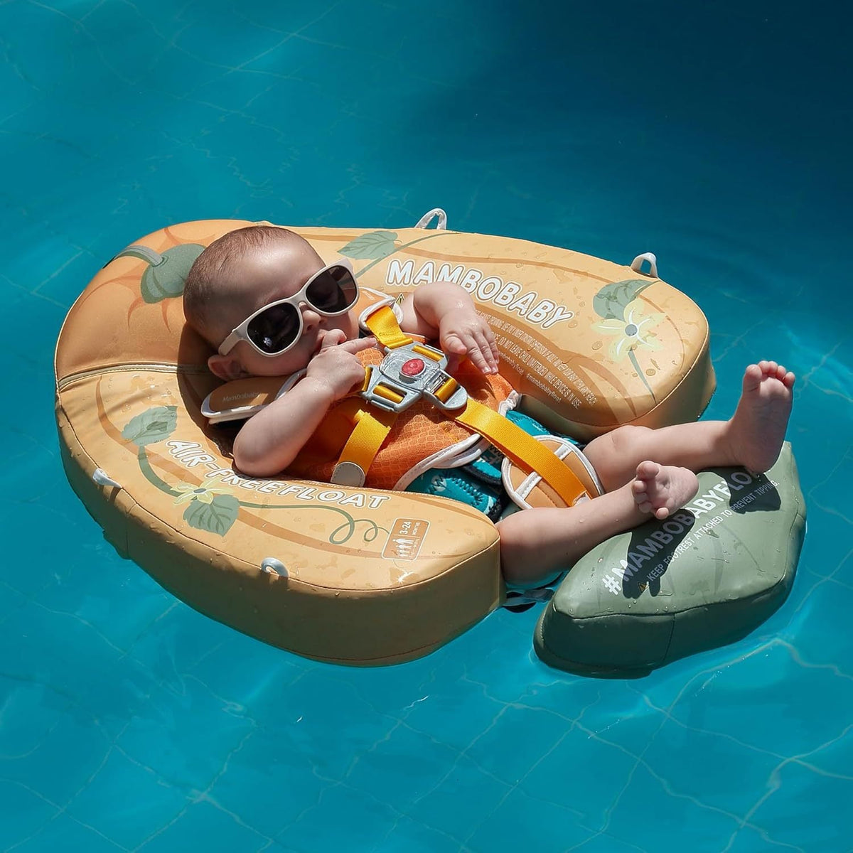 Baby resting in the Mambobaby Pumpkin float in a pool
