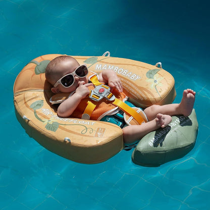 Baby resting in the Mambobaby Pumpkin float in a pool