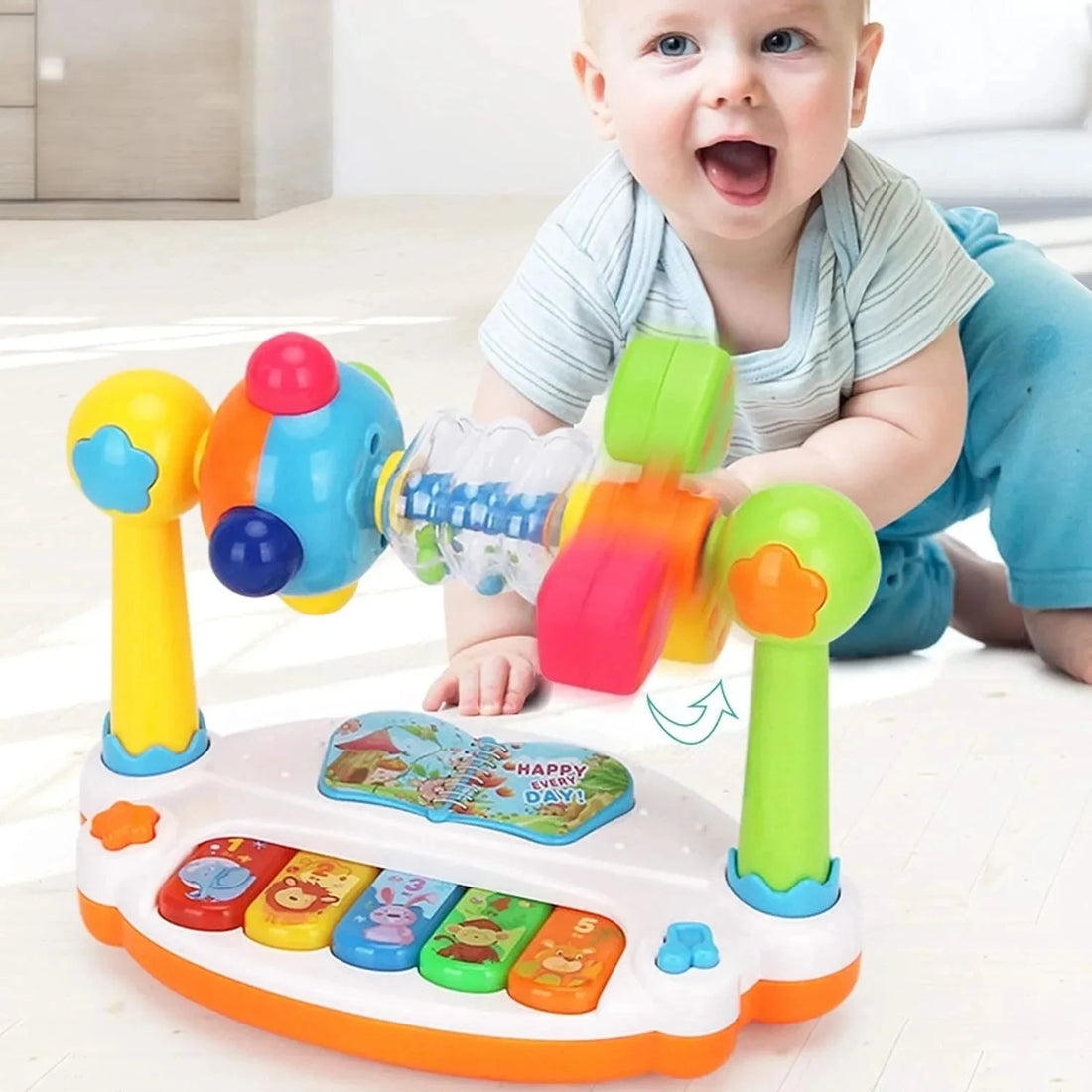 Baby playing with a musical piano activity toy